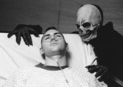 Hell House: a gay man dying of AIDs as Satan looks on